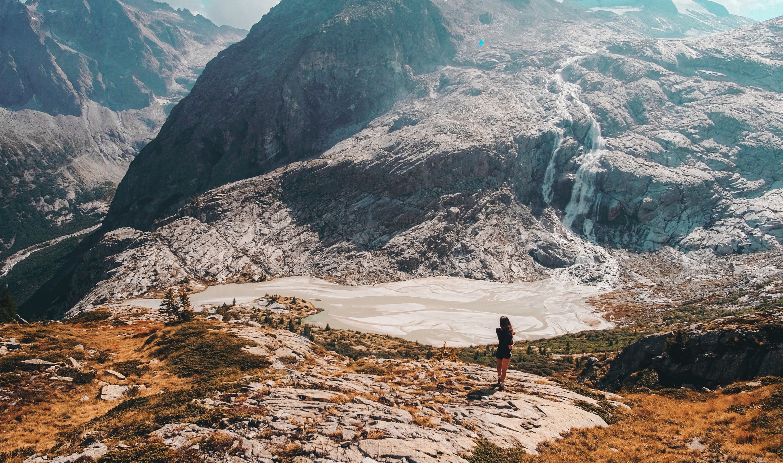 person-takes-in-a-waterfall-in-the-mountains.jpg