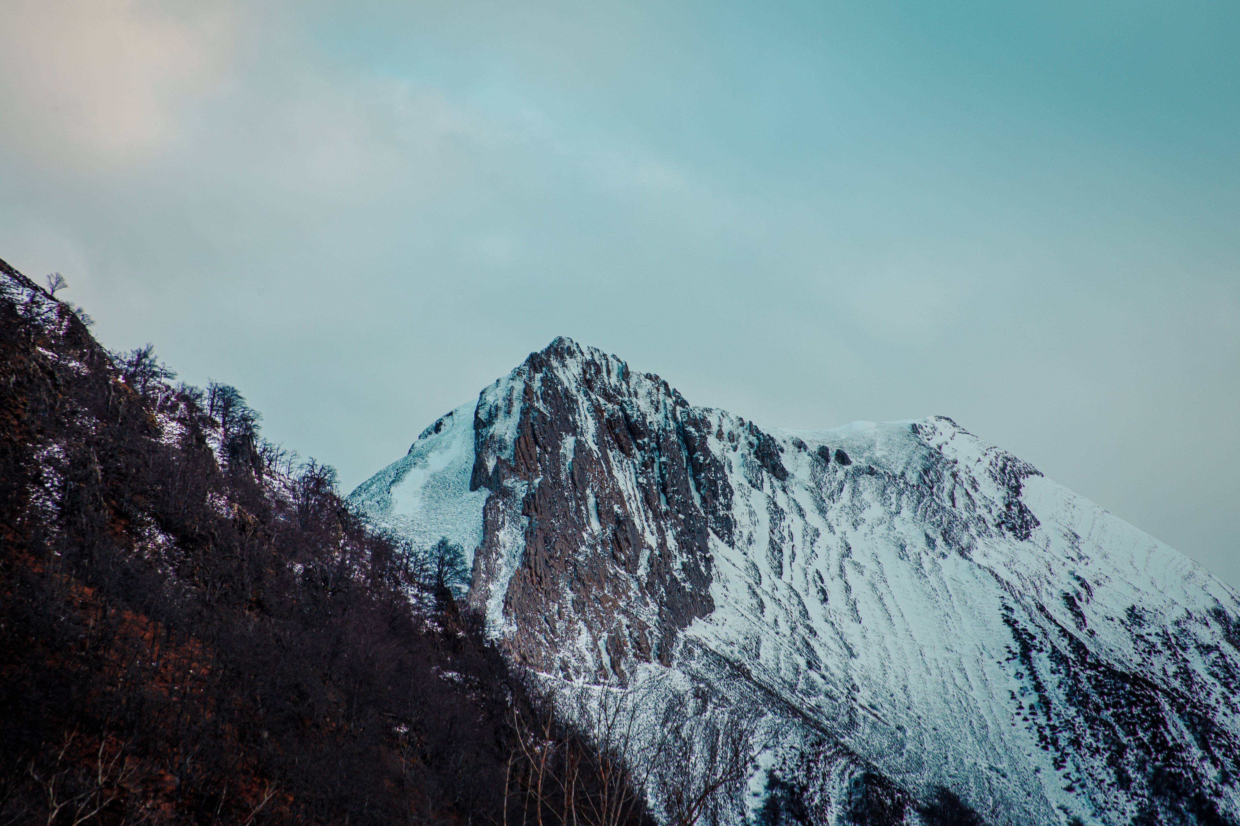 snow-covered-mountains-above-winter-landscape.jpg