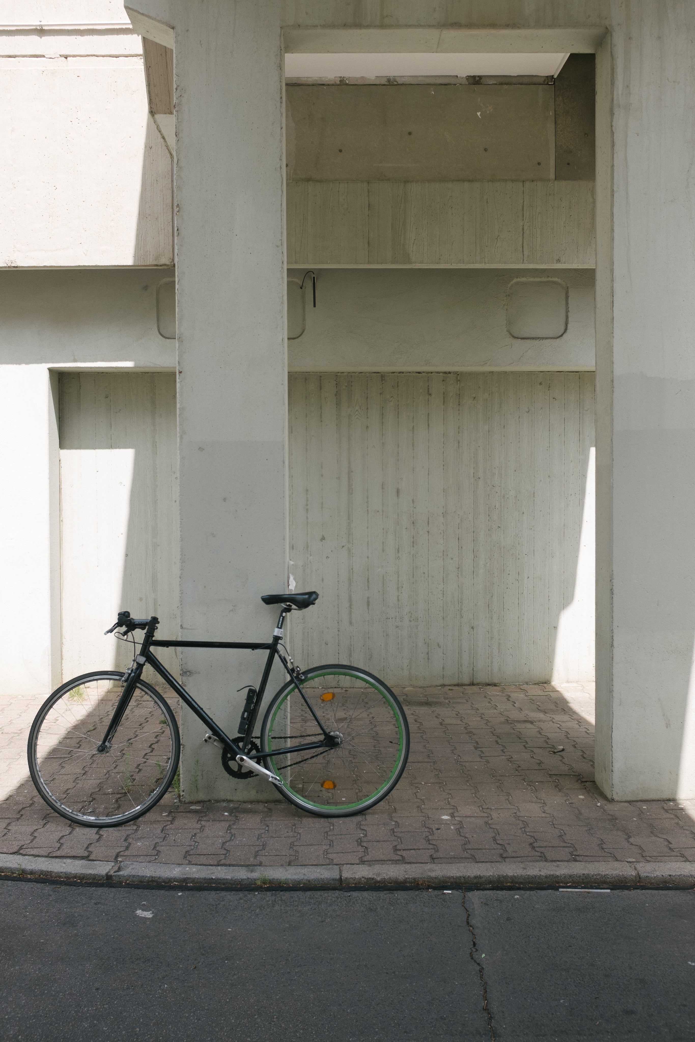 bike-sits-against-concrete-column.jpg