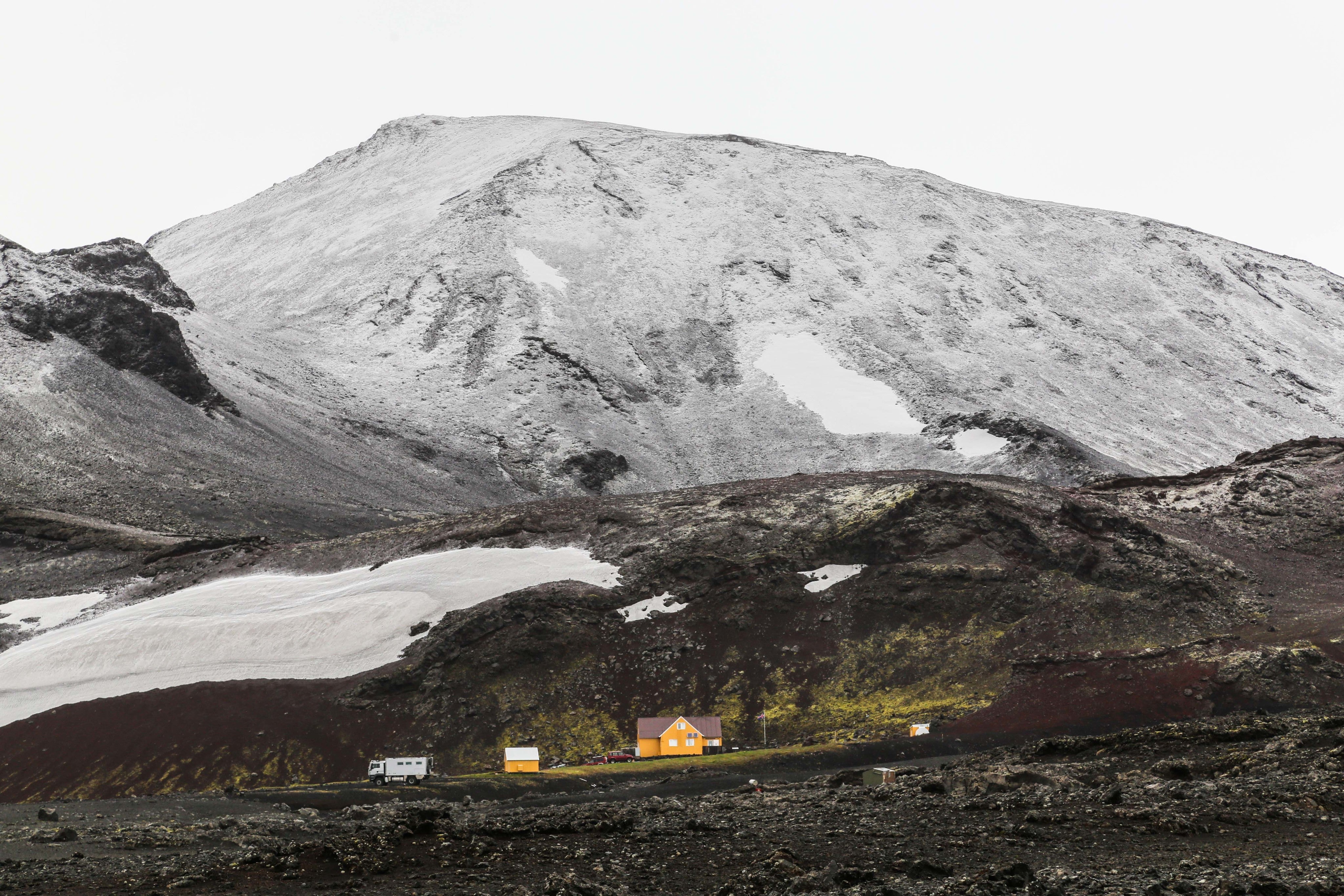 yellow-house-under-the-grey-mountain.jpg